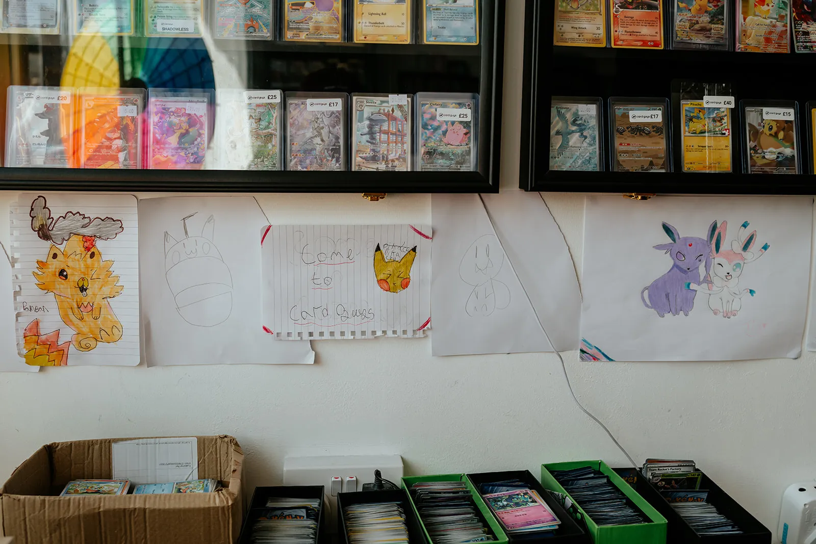 The Kids' Corner at Card Guys, with cards donated by the community and drawings from young collectors